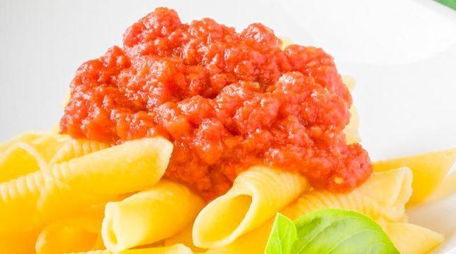 Photo of delicious adjika with pasta