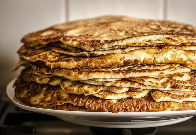 A stack of pancakes on sour cream