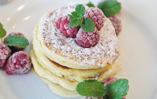 Semolina pancakes on water with raspberries