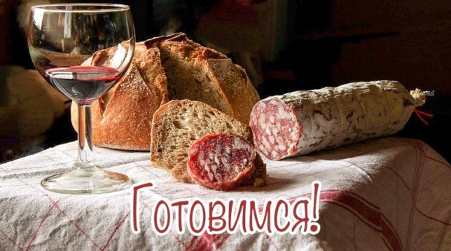 Glass of wine, bread and sausage